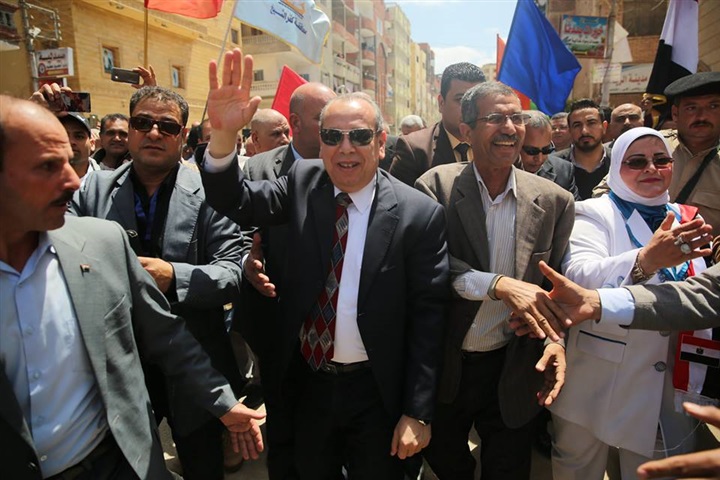 بالصور.. طوابير كفر الشيخ تحت ظل "العلم" وتصويت علي هتافات "تحيا مصر"