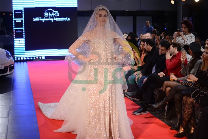 بالصور .. هاني البحيري يطلق عرض أزياء مع سيارة "بورش" بالصور .. هاني البحيري يطلق عرض أزياء مع سيارة "بورش"