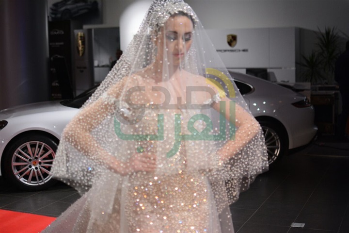 بالصور .. هاني البحيري يطلق عرض أزياء مع سيارة "بورش" بالصور .. هاني البحيري يطلق عرض أزياء مع سيارة "بورش"