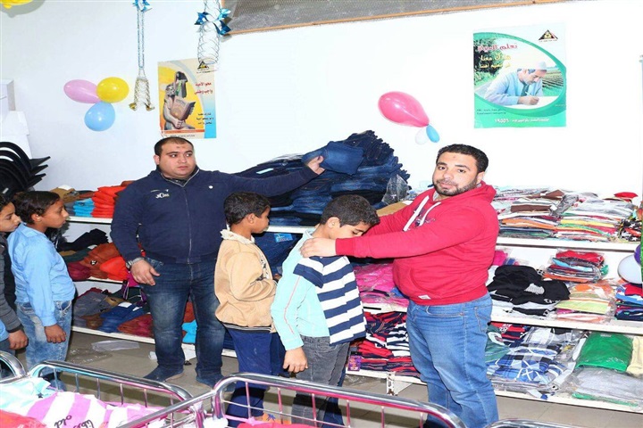 بالصور.. الأورمان توزع ملابس جديدة على 7000 طفل يتيم