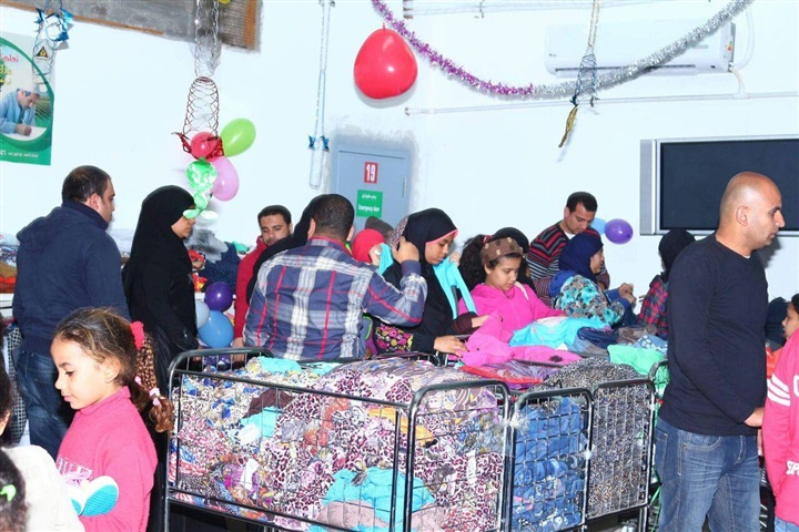 بالصور.. الأورمان توزع ملابس جديدة على 7000 طفل يتيم