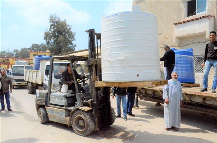 بالصور.. توزيع 8 طن كلور لمواجهة كورونا في كفر الشيخ