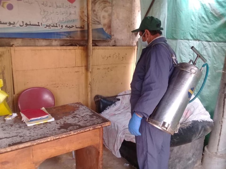 بالصور.. لمواجهة كورونا.. تعقيم ماكينات الصراف الآلي بكفر الشيخ