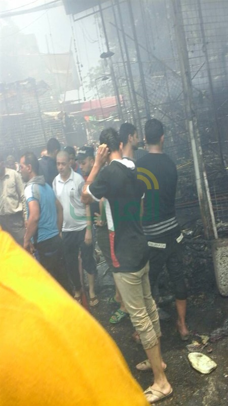 بالصور.. تفحم عددا من المحال التجارية والبضائع في حريق "سوق إمبابة".. و14 سيارة إطفاء لإخماد النيران