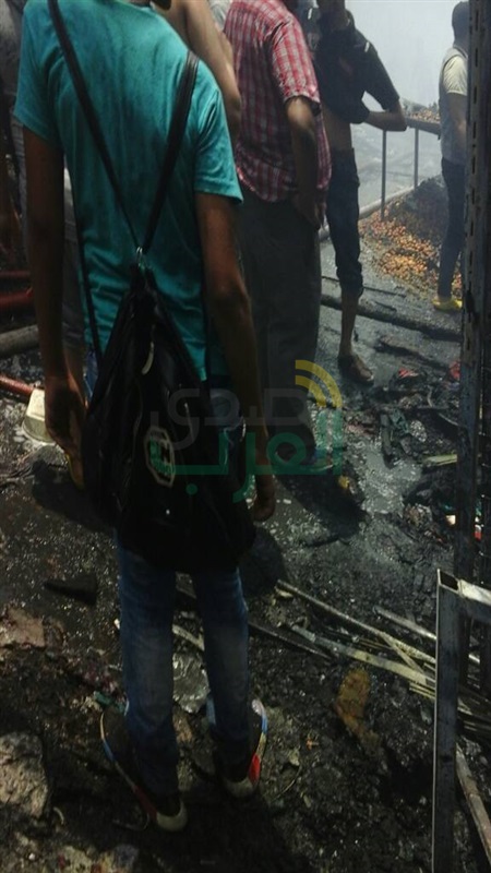بالصور.. تفحم عددا من المحال التجارية والبضائع في حريق "سوق إمبابة".. و14 سيارة إطفاء لإخماد النيران