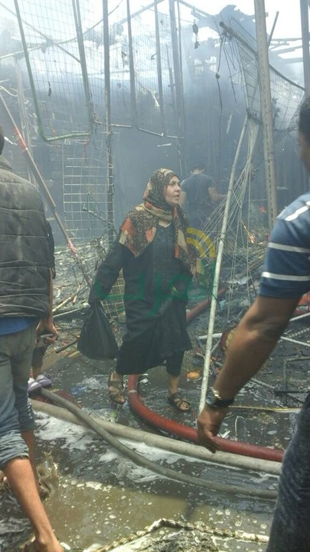 بالصور.. تفحم عددا من المحال التجارية والبضائع في حريق "سوق إمبابة".. و14 سيارة إطفاء لإخماد النيران