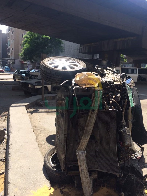 بالصور.. إصابة شخص إثر سقوط سيارة من أعلى كوبري أكتوبر