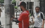 صيانة لأعمدة الإنارة وتأمين الكابلات بشارع باسيلى بالعمرانية
