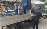 رفع محتويات سنتر بشارع ناصر الثورة بالعمرانية
