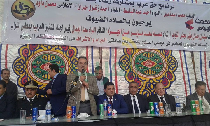 بالصور..  كفنان ينهيان خصومة ثأرية بالجيزة فى حراسة أمنية مشددة